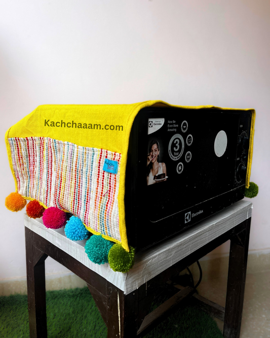 Yellow Cotton Slub Solid Microwave Cover with Multicolored Jacquard Fabric Pockets and Rainbow Pompom