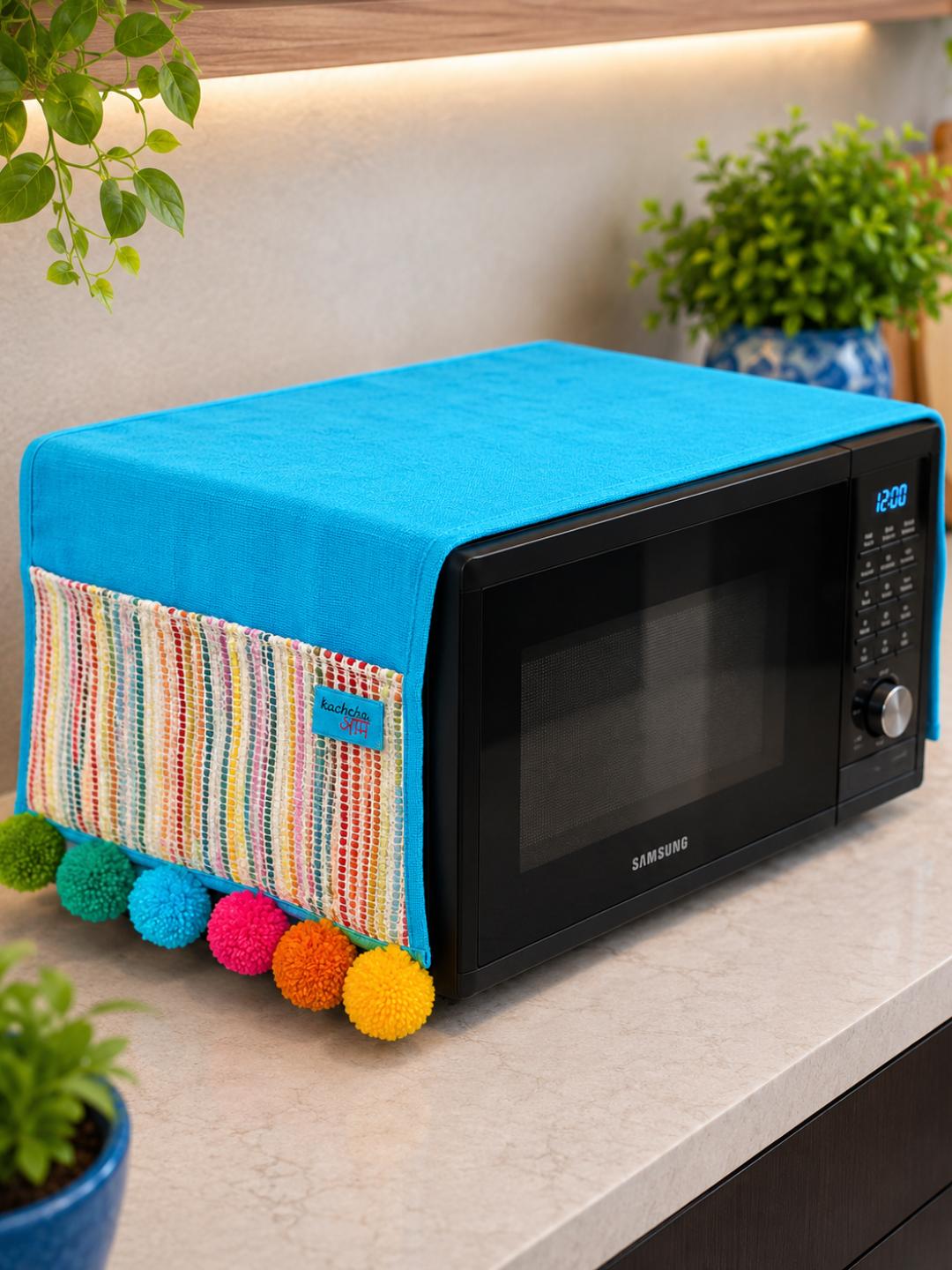 Sky Blue Cotton Slub Solid Microwave Cover with Multicolored Jacquard Fabric Pockets and Rainbow Pompom